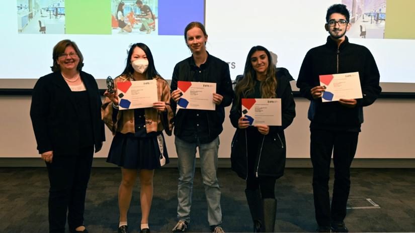 The team on stage at the UTS Tech Festival holding their award certificates